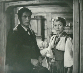 Peter Arens als Arzt mit Liselotte Pulver (Vreneli) in dem Film "Uli der Pächter (1955); Quelle: www.cyranos.ch bzw. Archiv "Praesens-Film AG, Zürich", mit freundlicher Genehmigung von Peter Gassmann (Praesens-Film AG, Zürich); Copyright Praesens-Film AG 