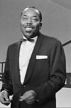 Orlandus Wilson Ende Dezember 1964 bei einem Konzert mit dem "Golden Gate Quartet" in den Niederlanden (Ausschnitt des Originalfotos); Rechteinhaber: Nationaal Archief�(Den Haag, Rijksfotoarchief; Bestandsnummer: 917-2837); Urheber/Fotograf: F.N. Broers / Anefo; Quelle: Wikimedia Commons (Ausschnitt des Originalfotos); Lizenz: CC0 1.0 (Verzicht auf das Copyright)